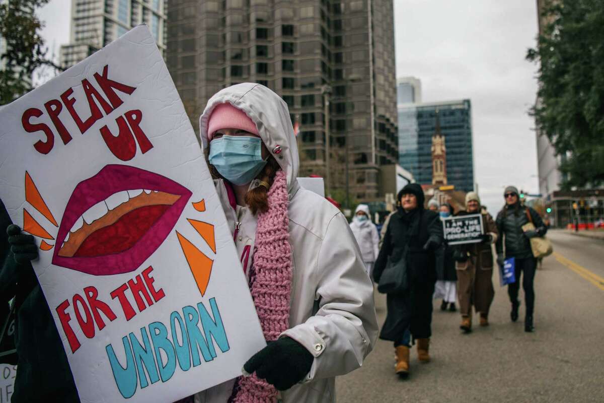 Pro-life demonstrators march during the "Right To Life" rally on January 15, 2022 in Dallas, Texas.