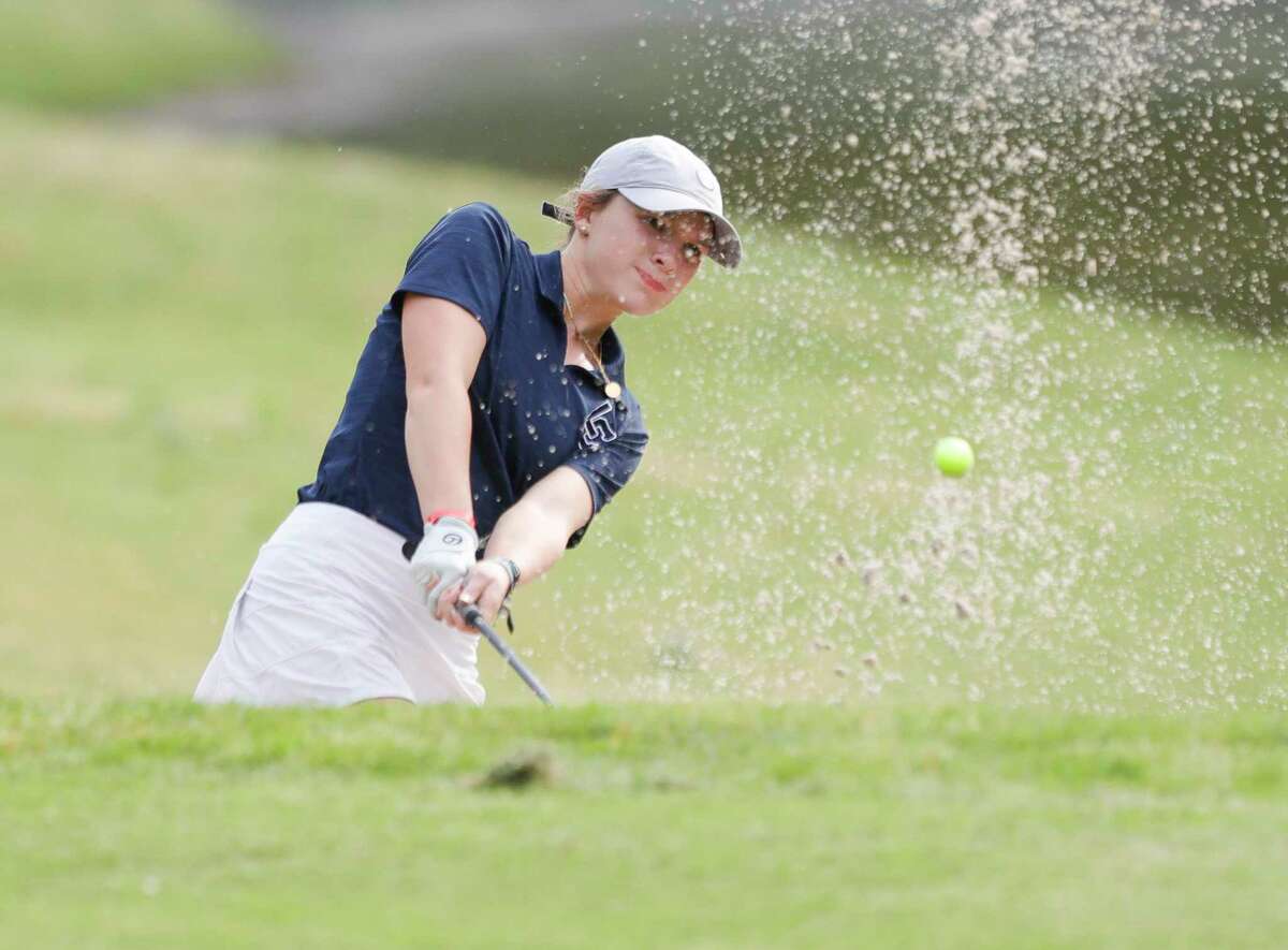 Lake Creek’s Katya Tibbetts hits out of a bunker and onto the fourth green during the opening round of the Region III-5A golf championship at Margaritaville Lake Resort, Wednesday, April 20, 2022, in Montgomery.