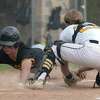 Law’s Mike Merchant is safe at the plate as Hand catcher Connor Powell tags him too late.