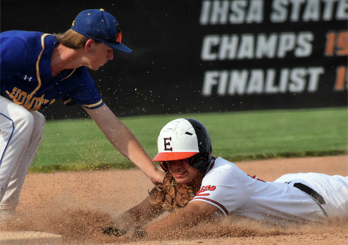 Edwardsville's Caeleb Copeland attempts to avoid a tag at third against Francis Howell on Friday at Tom Pile Field in Edwardsville.