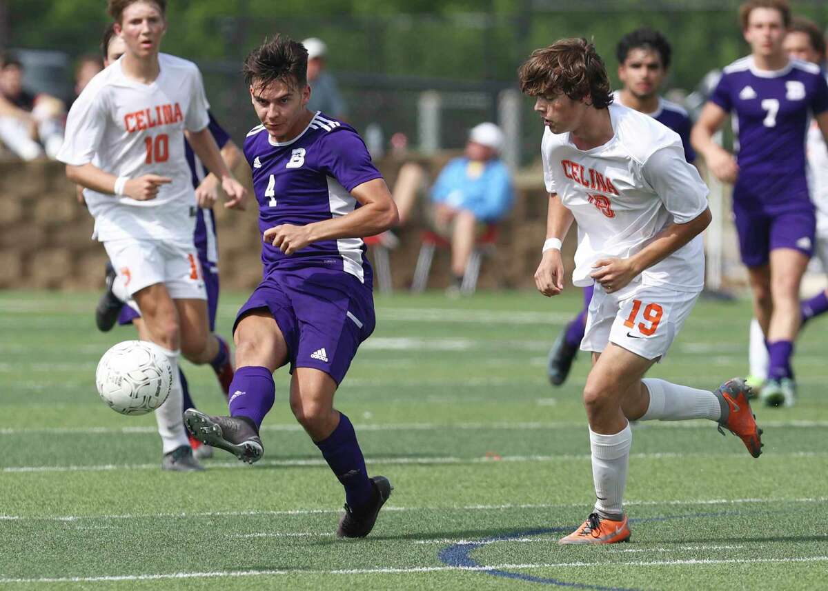 Boerne Greyhounds' Landon Murphy (04) passes the ball against Celina Bobcats' Andy Allam (19) in the Class 4A soccer state championship game in Georgetown on Friday, Apr. 15, 2022. Boerne defeated Celina, 2-1, in overtime to win their second and back-to-back state title.
