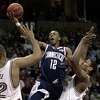 Taliek Brown (12), shown here playing in a 2003 NCAA tournament game against Stanford, is leaving his position as UConn’s director of player development that he’s held since 2018. (AP Photo/Paul Sancya)