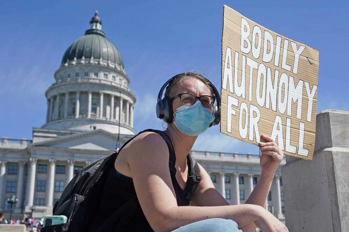 A woman attends an abortion-rights rally at the Utah State Capitol Saturday, May 14, 2022, in Salt Lake City. Demonstrators are rallying from coast to coast in the face of an anticipated Supreme Court decision that could overturn women's right to an abortion.