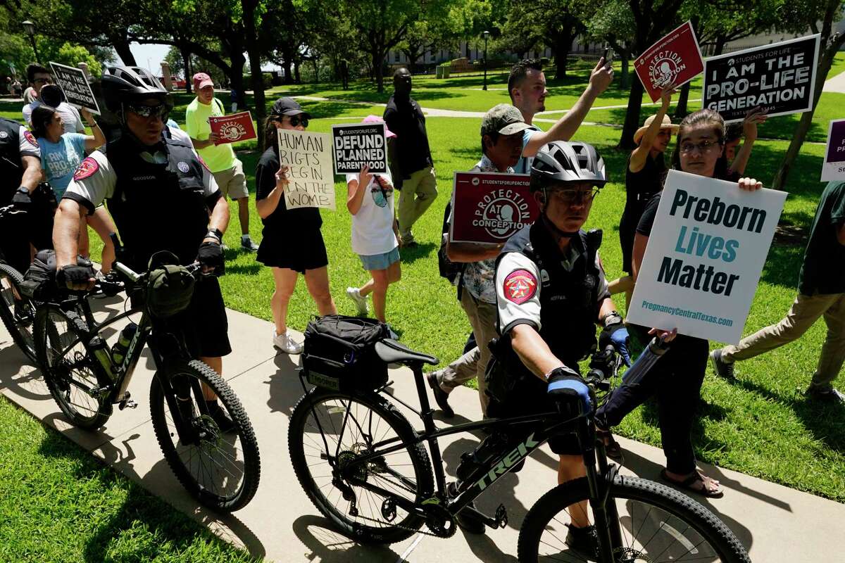 Anti-abortion demonstrators are separated from Abortion rights demonstrators state police during a rally at the Texas Capitol, Saturday, May 14, 2022, in Austin, Texas. Demonstrators are rallying from coast to coast in the face of an anticipated Supreme Court decision that could overturn women’s right to an abortion. More (AP Photo/Eric Gay)