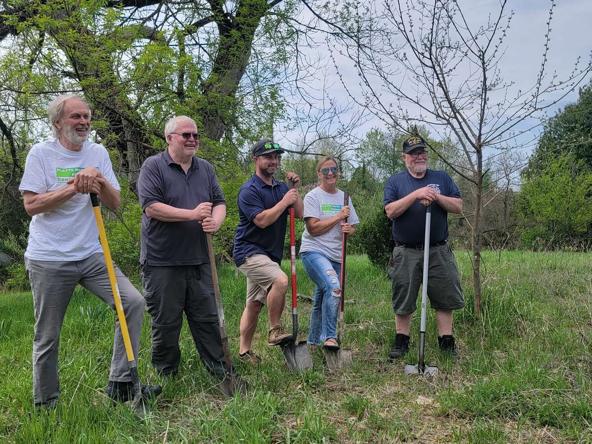 Ingemar Johansson, president of HARP, Paul Schulte, Peter Galopin and Lori Malmstrom, HARP board members, and Mike Mead, representative of Homestead Township, prepare to break ground on Platte River Park on Saturday.