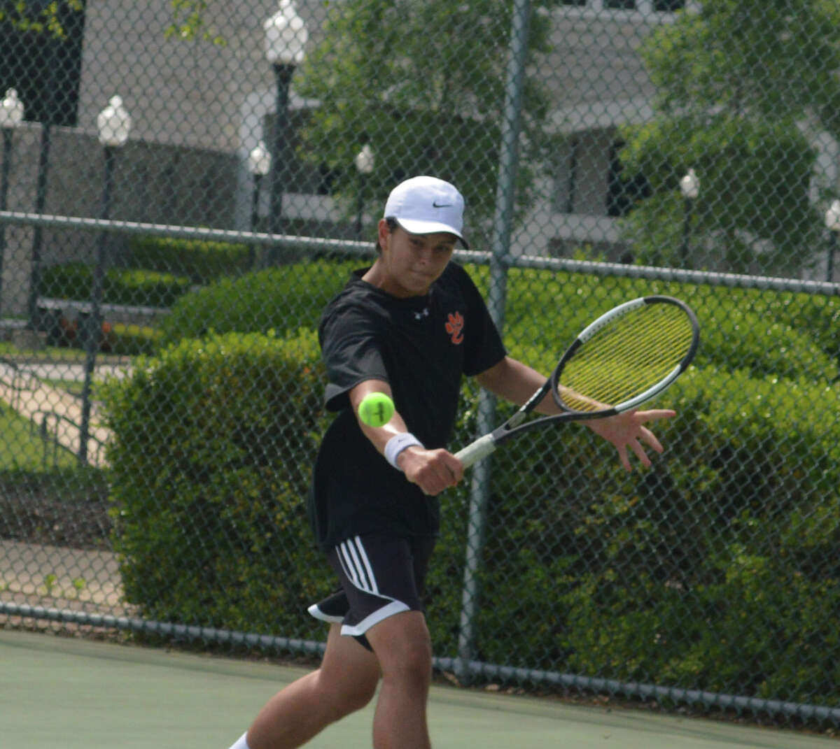 Jesse Hattrup at the Southwestern Conference tournament at the Andy Simpson Tennis Complex on the campus of Lewis and Clark Community College.