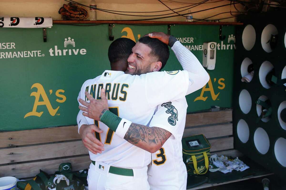 OAKLAND, CALIFORNIA - MAY 14: Luis Barrera #13 of the Oakland Athletics celebrates with Elvis Andrus #17 after hitting a walk-off three-run home run in the bottom of the ninth inning against the Los Angeles Angels during game one of a doubleheader at RingCentral Coliseum on May 14, 2022 in Oakland, California. (Photo by Lachlan Cunningham/Getty Images)