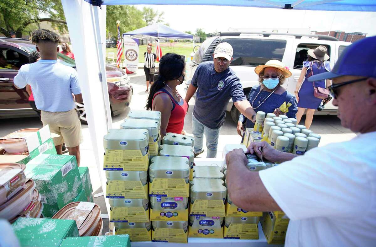 Volunteers help Congresswoman Sheila Jackson Lee hand out baby formula as she hosted a drive-thru baby formula giveaway, in partnership with the nonprofit National Association of Christian Churches, in Third Ward for mothers and babies in need at Jack Yates High School on Saturday, May 14, 2022 in Houston.