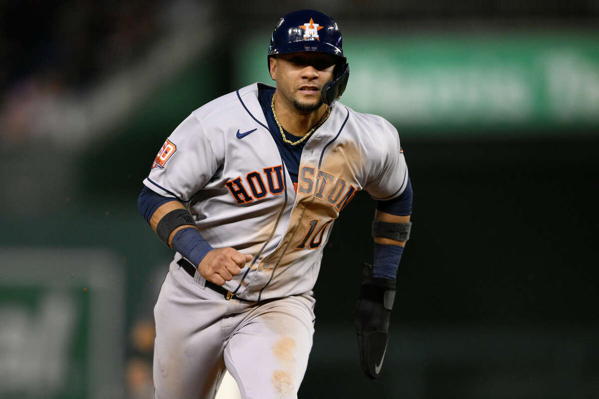 Houston Astros' Yuli Gurriel runs toward third on a single by Aledmys Diaz during the fourth inning of a baseball game against the Washington Nationals, Saturday, May 14, 2022, in Washington. Gurriel scored on the play. (AP Photo/Nick Wass)