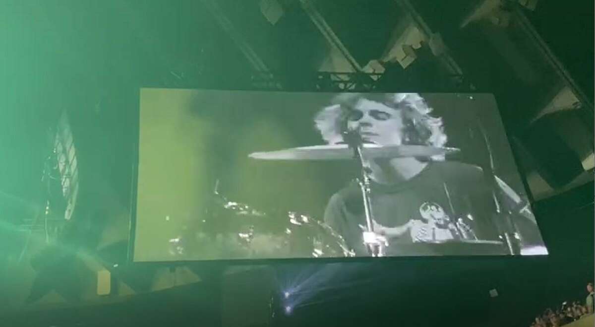 Kai Neukermans of Mill Valley sits in on drums for one song with Pearl Jam Friday at Oakland Arena in an image captured from video,