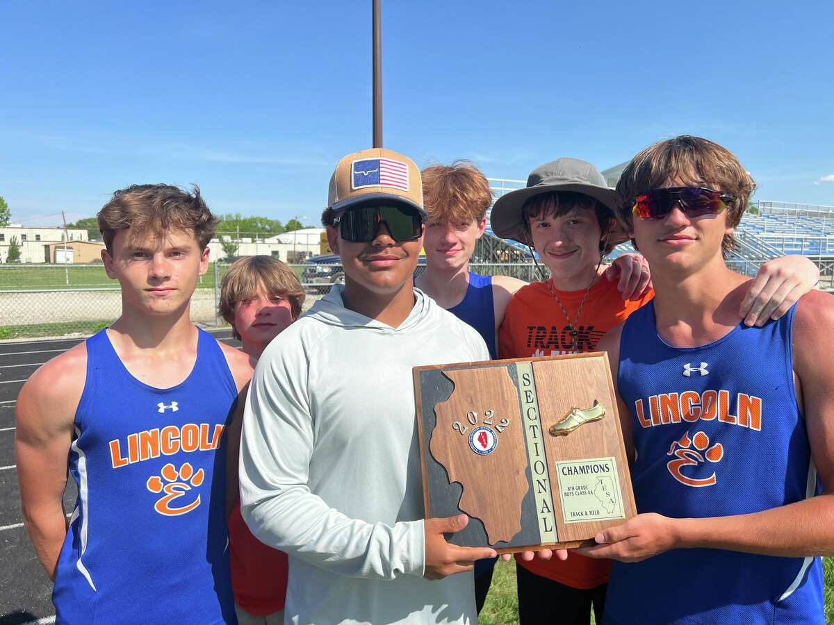 The Lincoln Middle School eighth-grade boys track and field team poses with the sectional championship plaque.