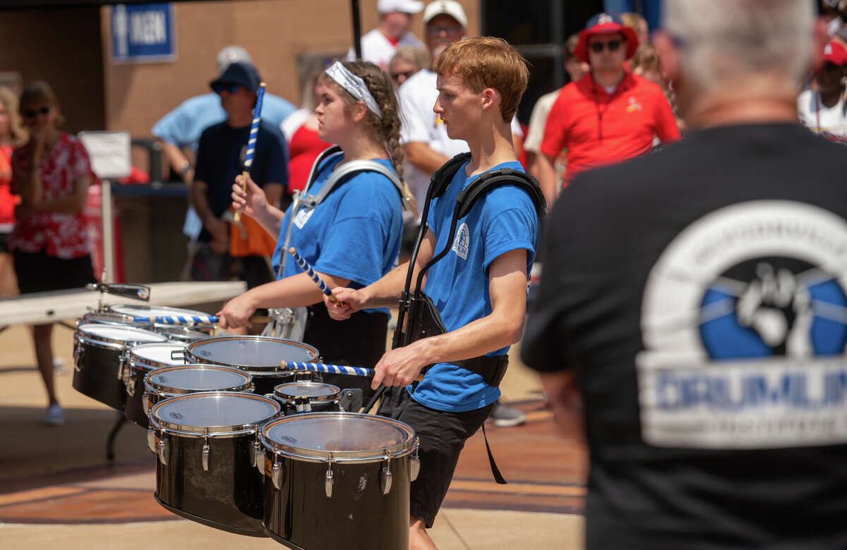 Jacksonville Drumline Institute section leader Laynie Barringer and student Ian Meek perform Saturday in Busch Stadium's Ford Plaza as part of Jacksonville Night before the St. Louis Cardinals game against the San Francisco Giants.