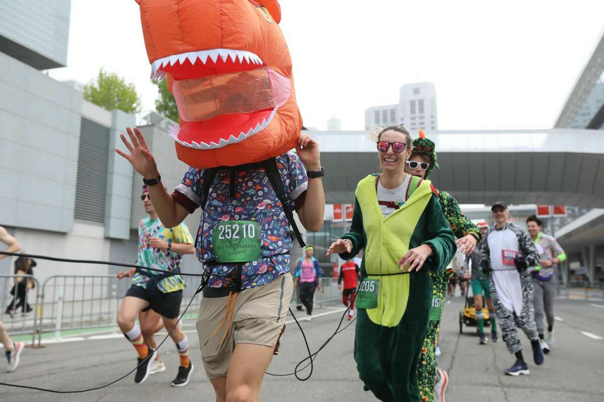 Costumed runners compete in the Bay to Breakers race in San Francisco on May 15, 2022.
