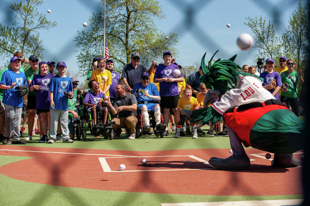 Athletes of the Middle of the Mitt Miracle League pelt Great Lakes Loons mascot Lou E. Loon with foam baseballs on May 14, 2022 at the Midland Miracle Field.