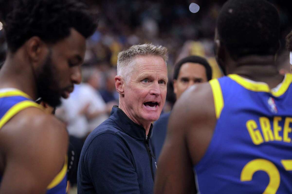 Warriors head coach Steve Kerr talks with players in the huddle during a break in the action In the first half as the Golden State Warriors played the Memphis Grizzlies in Game 1 of the second round of the NBA Playoffs at Fedex Forum in Memphis, Tenn., on Sunday, May 1, 2022.