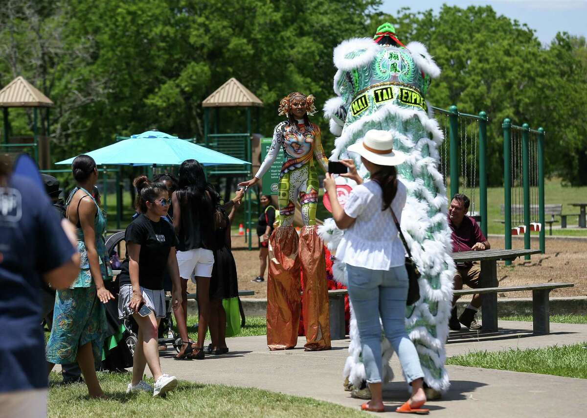 Community members attend the Cigna Sunday in the Park event - which featured live entertainment, dancing, free food, inflatables and outdoors games - at Hackberry Park on Sunday, May 15, 2022, in Houston.