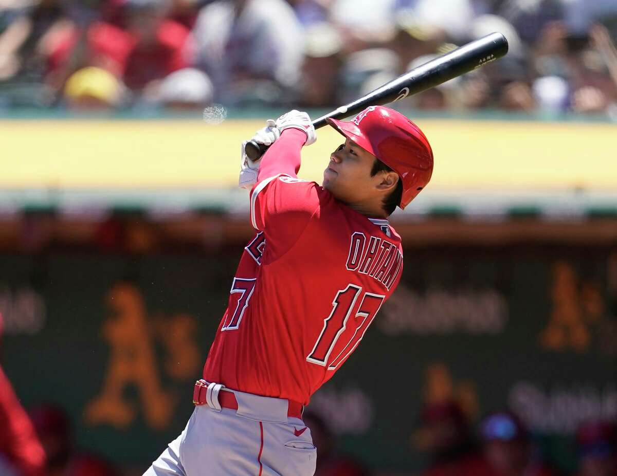 Angels designated hitter Shohei Ohtani slams a two-run homer against the A’s in the firt inning.