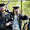 Dianna Benz, of Danbury, center, celebrates receiving her diploma on Sunday from Western Connecticut State University at commencement exercises at the Macricostas School of Arts & Sciences.
