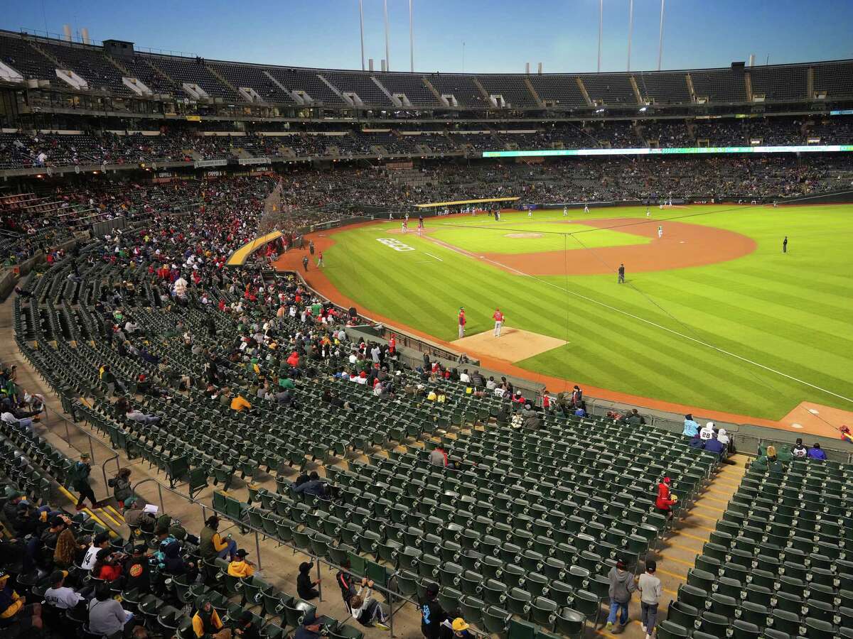 Another evening with dismal attendance for the Athletics, who drew fewer than 3000 to a game earlier in the month at the large, aging RingCentral Coliseum, in Oakland, Calif., May 13, 2022. For years, the A's have been in the hunt for a sparkly new stadium or an energetic new city, creating a limbo that almost goads fans into staying away. (Jim Wilson/The New York Times)
