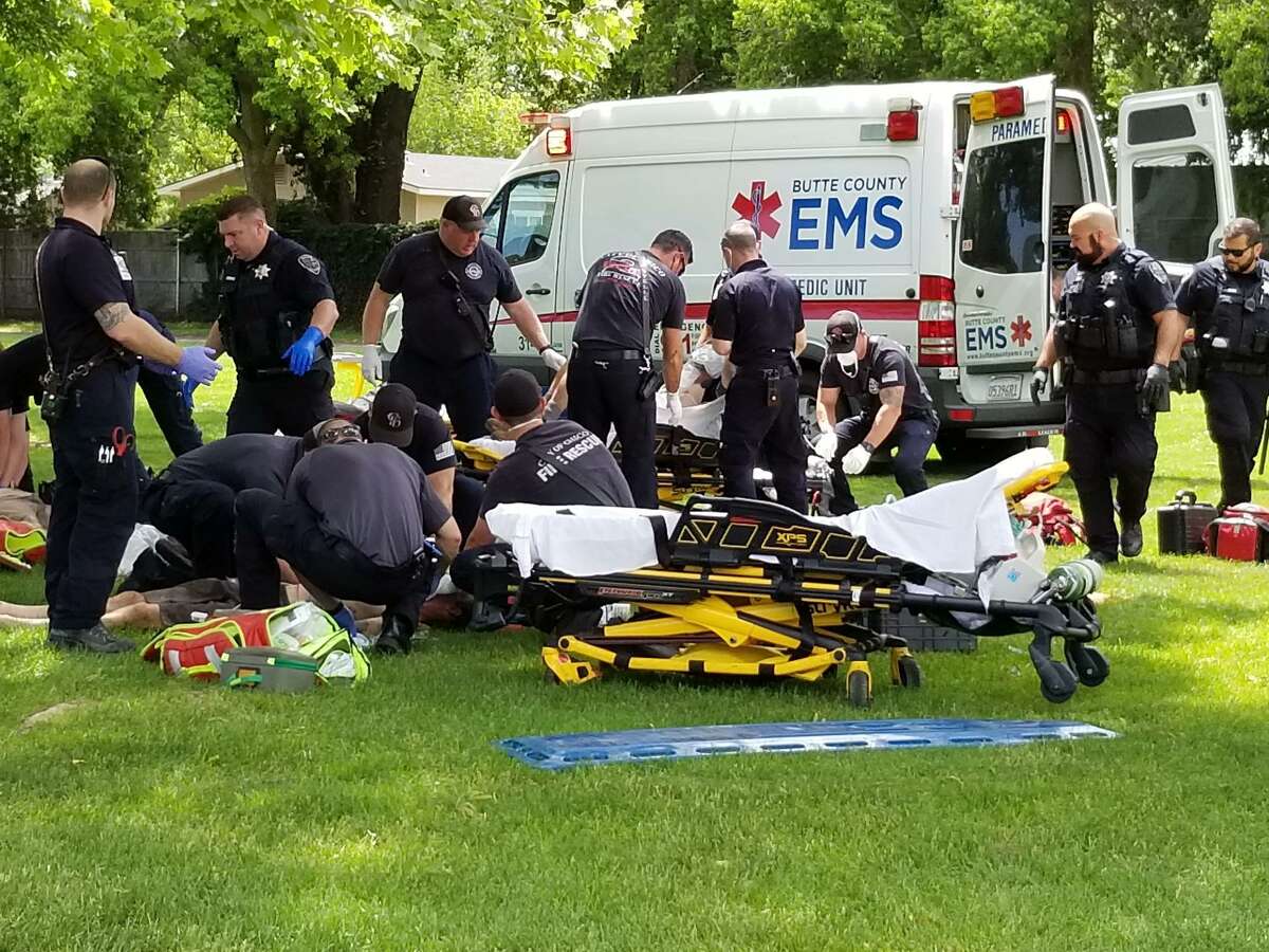 First responders try to help four men found unconscious in Community Park in Chico.