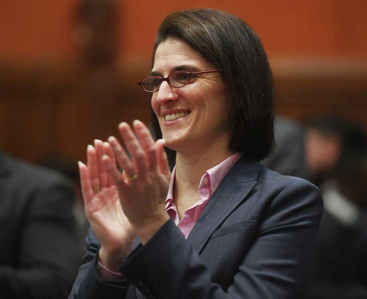 Rep. Cristin McCarthy-Vahey, D-Fairfield, applauds during Gov. Ned Lamont's budget address in 2019.