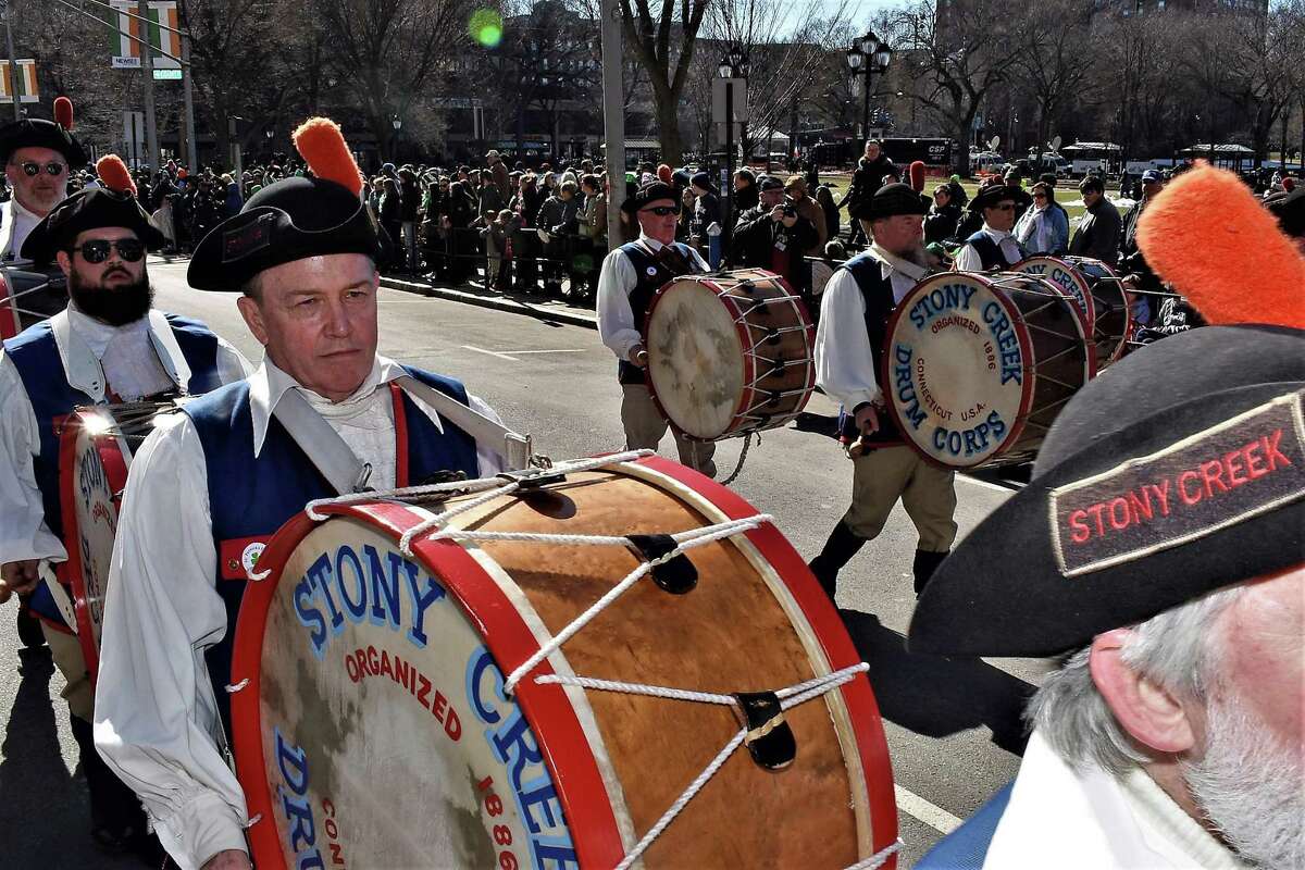 Bass drummer Joe Mooney performing at St. Patrick’s Day in New Haven