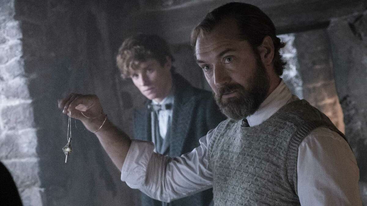 Albus Dumbledore (Jude Law, foreground) and Newt Scamander (Eddie Redmayne) in "Fantastic Beasts: The Secrets of Dumbledore."