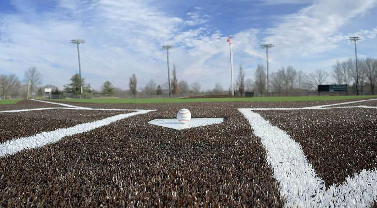 A baseball sits on home plate at the renovated Lloyd Hopkins Field in Gordon Moore Park. A new artificial playing surface and a video board are among the upgrades. Monday, it was announced that the field will be the site of an NCAA Division III regional baseball tournament this weekend.