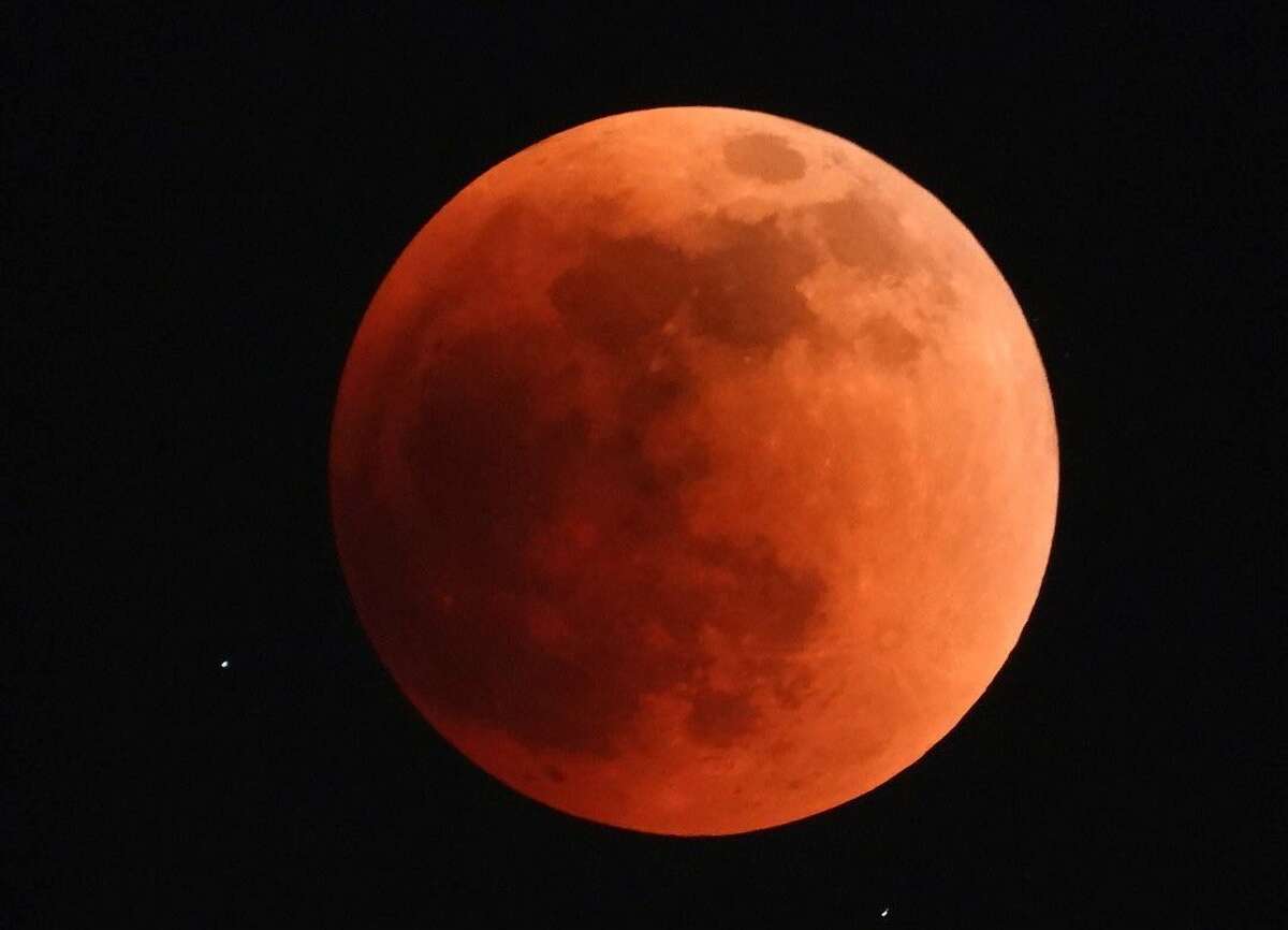 Houston resident Debbie Leo captured photos of the super flower blood moon Sunday evening. 