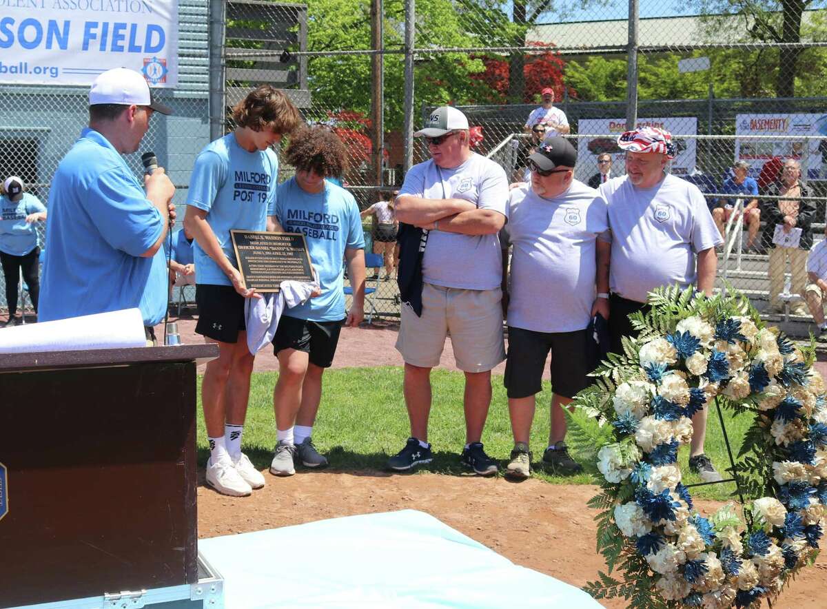 Members of the Babe Ruth/Jr. Major Leagues present the honorary plaque that will adorn the walls of the field house at the Daniel S. Wasson Field. Making the presentations are (l to r): John Wezenski, (League president), Quentin Bell (player), John Messore (player), and Daniel Wasson’s brothers: Ray Wasson, Alan Wasson, and Jeff Wasson.