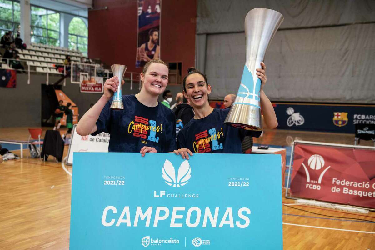 Greenwich's Abbie Wolfe, left, celebrates with an FC Barcelona teammate after winning the Liga Femenina Challenge.