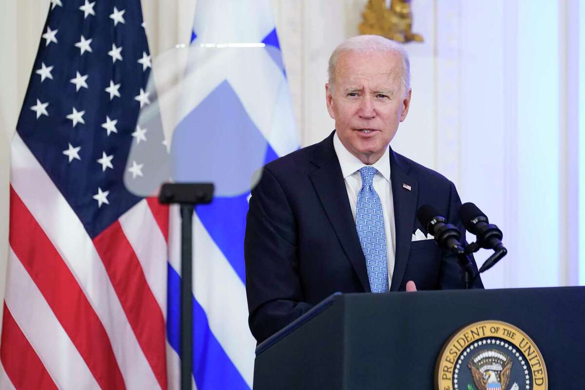 President Biden speaks during a reception for Greek Prime Minister Kyriakos Mitsotakis in the East Room of the White House in Washington on Monday.