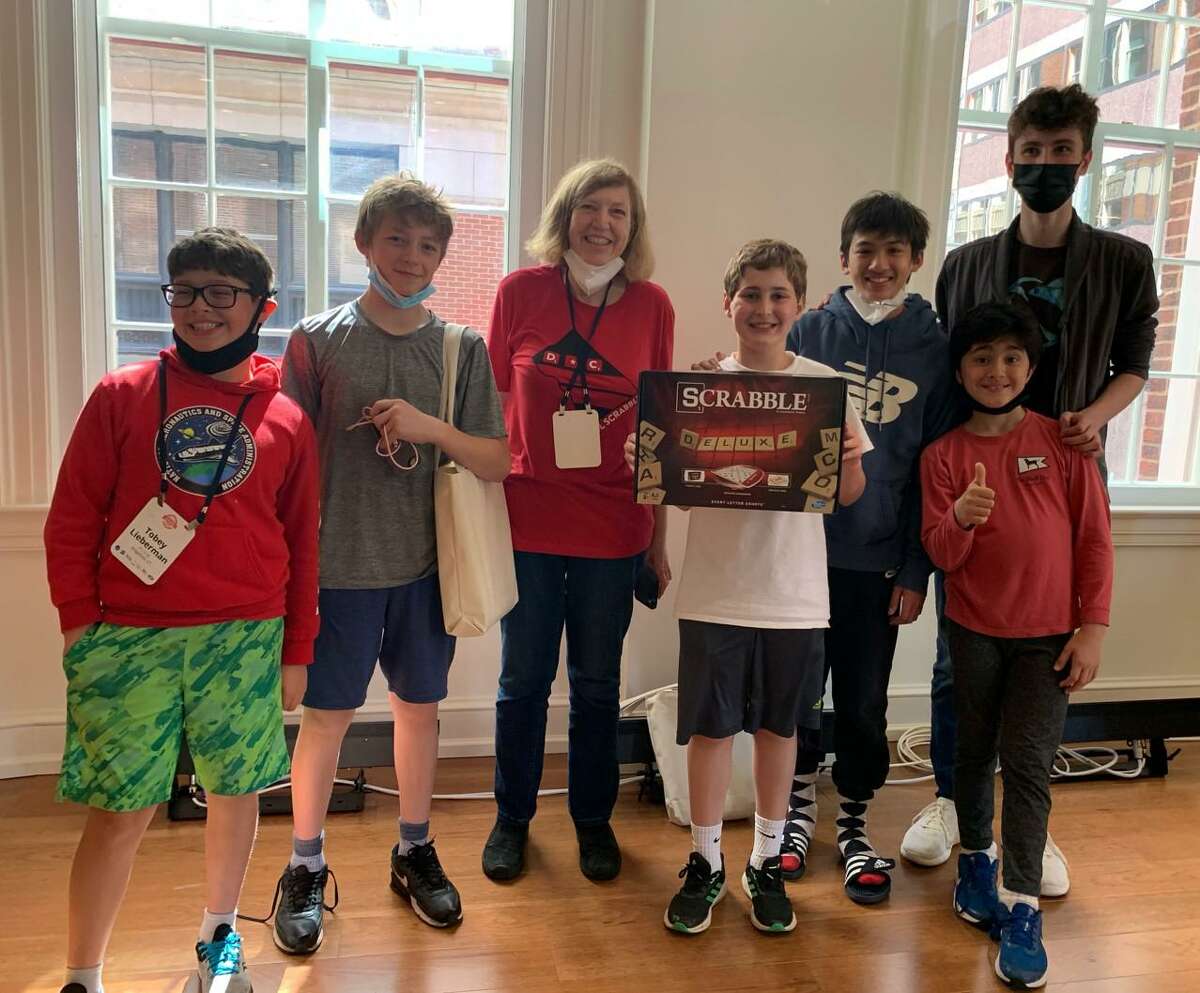 Several Ridgefield students excelled at the 2022 North American School Scrabble Championship held May 14-15 at Planet Word in Washington, D.C. From left to right: Tobey Lieberman, Jake Nadol, Coach Cornelia Guest, Will Knispel, Nathanael Campos, Theo Diamond (in front), and Jeffrey Pogue.