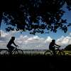 Cyclists go for a ride along the Tod's Driftway loop on a sunny day at Greenwich Point Park in Old Greenwich, Conn.