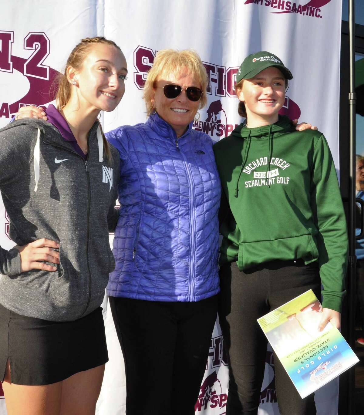 Madison Martel, left, of Catholic Central High School in Troy, and Dannah Smith of Shalmont pose with Dottie Pepper at the first Section 2 Girls Golf Sectional and State Qualifier on Oct. 11, 2019, at the Fairways of Halfmoon.