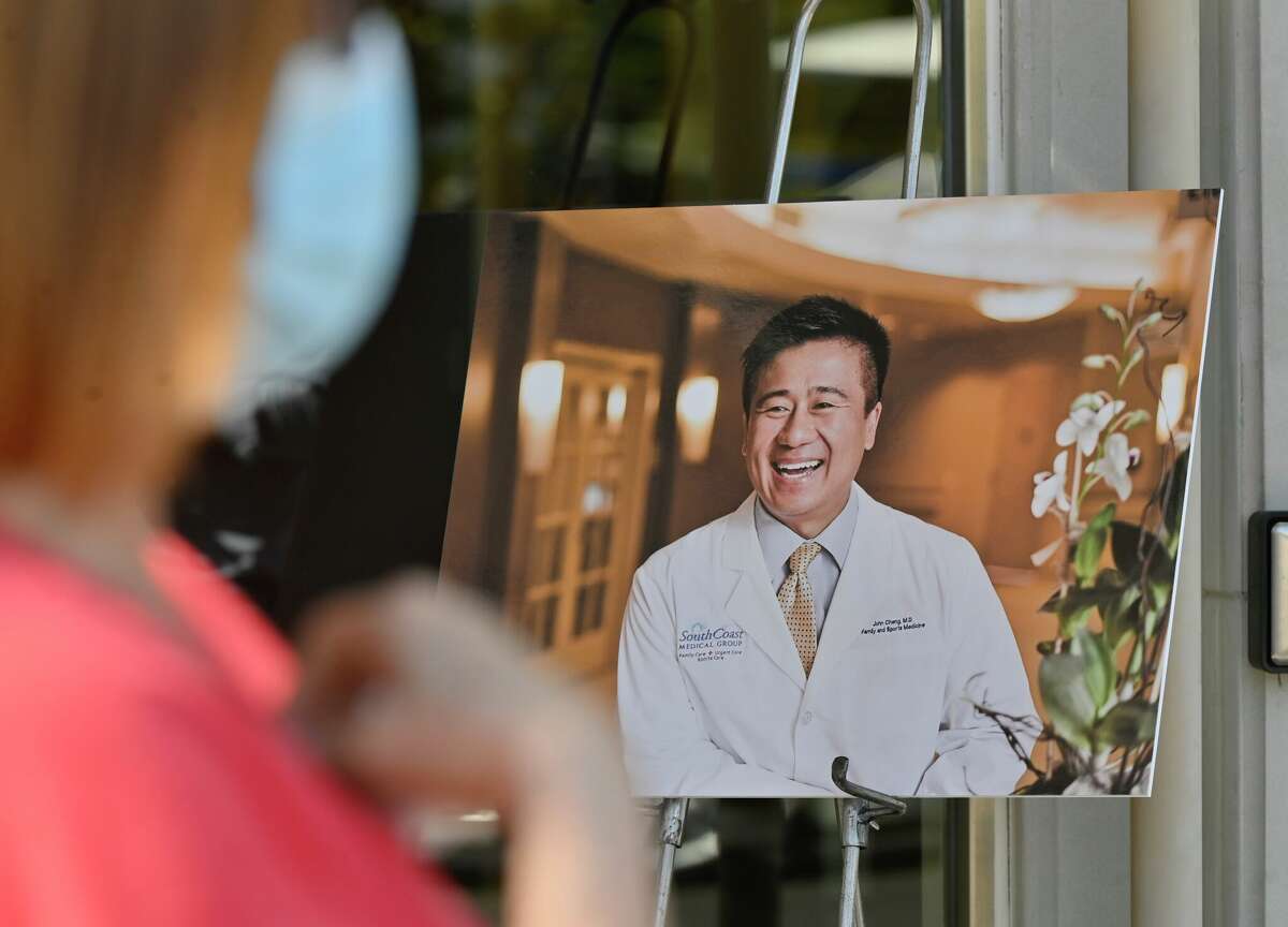 Deborah Kipers, a patient of shooting victim Dr. John Cheng, talks about him outside his office in Aliso Viejo, CA, on Monday, May 16, 2022. Cheng was killed in a shooting at Geneva Presbyterian Church in Laguna Woods on May 15. (Photo by Jeff Gritchen/MediaNews Group/Orange County Register via Getty Images)