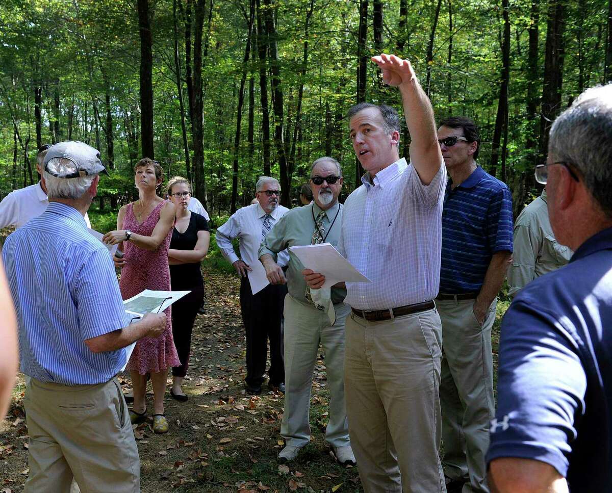 Joel Lindsay with Ameresco Candlewood Solar LLC leads a walking tour for the state Siting Council of the Candlewood Mountain area in 2017.