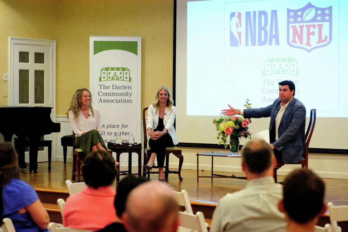 Two Darien women -- Amy Brooks, seated at left, and Renie Anderson -- who hold top positions in the NBA and NFL, respectively, were the featured speakers at the Darien Community Association's "Women in Professional Sports Leadership" event in Darien, Conn., on Thursday May 12, 2022. At right is ESPN's Jay Alter, a native of Darien and the event's moderator.