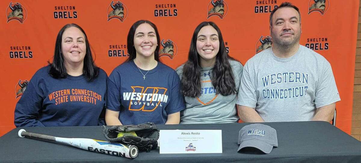 Alexis Resto is flanked by her mom Kristine (left), sister Kayla and dad Mike when she signed to play softball at Western Connecticut State University.