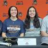 Alexis Resto is flanked by her mom Kristine (left), sister Kayla and dad Mike when she signed to play softball at Western Connecticut State University.