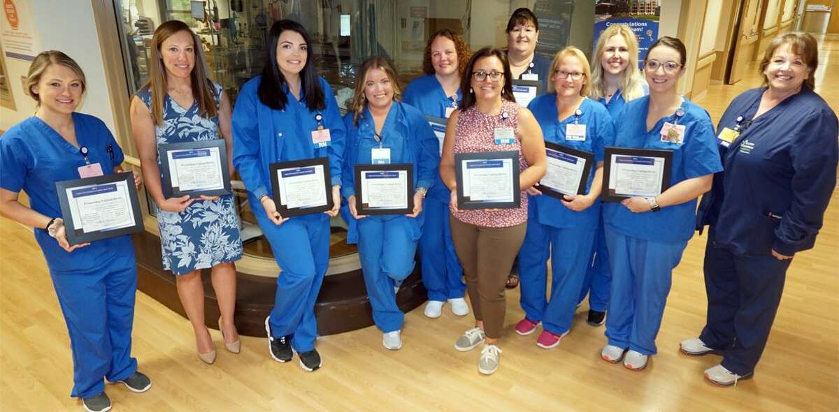 Members of the Promoting Vaginal Births team at Alton Memorial Hospital are Jessica Mossman, Renee Strowmatt, Dr. Jamie Hardman, Dr. Rachel Durham, Diane Lahey, Erin Unverzagt, Katie Furl, Malinda Turner, Laura Gibbs, Nicole Woods and Haley St. Peters. Along with Cindy Bray, director of Patient Care (far right), all are in the photo except for Dr. Hardman and Nicole Woods.