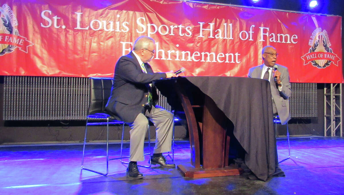 Edwardsville graduate Morris Bradshaw, right, is interviewed by St. Louis Blues public address announcer Tom Calhoun on Monday night, when Bradshaw was inducted into the St. Louis Sports Hall of Fame in the Illinois Enshrinement Dinner at Gateway Classic Cars in O’Fallon.
