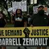 Amyrose Felan, from left, Camille Wright, and Hector Rodriguez lead a group of supporters of Darrell Zemault Sr., as they demand justice for him outside Public Safety Headquarters downtown, where they marched from the Bexar County Courthouse, on Saturday, Sept. 26, 2020.