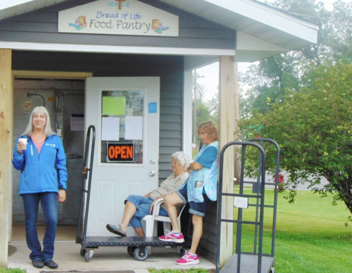 Volunteers at Bread of Life Food Pantry work each week to make sure local families have food. The money awarded through the GLE People Fund helps keep the shelves stocked. Pictured left to right is director Lynne Mills, shopper Marianne Cooke and volunteer Sandy Dode.