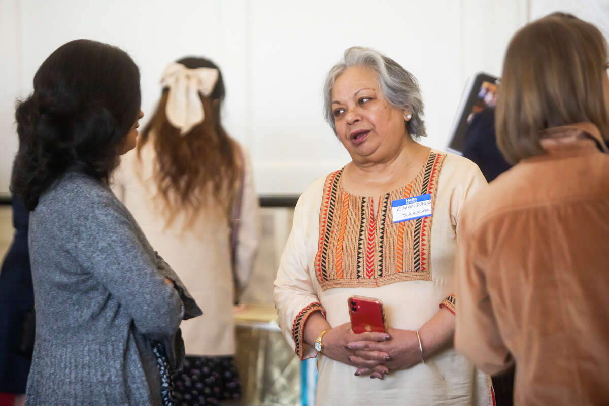 International Women's Club of Midland founder Chandana Sarkar speaks with friends as members of the organization gather in celebration of its 50th anniversary Tuesday, May 17, 2022 at Midland Country Club.