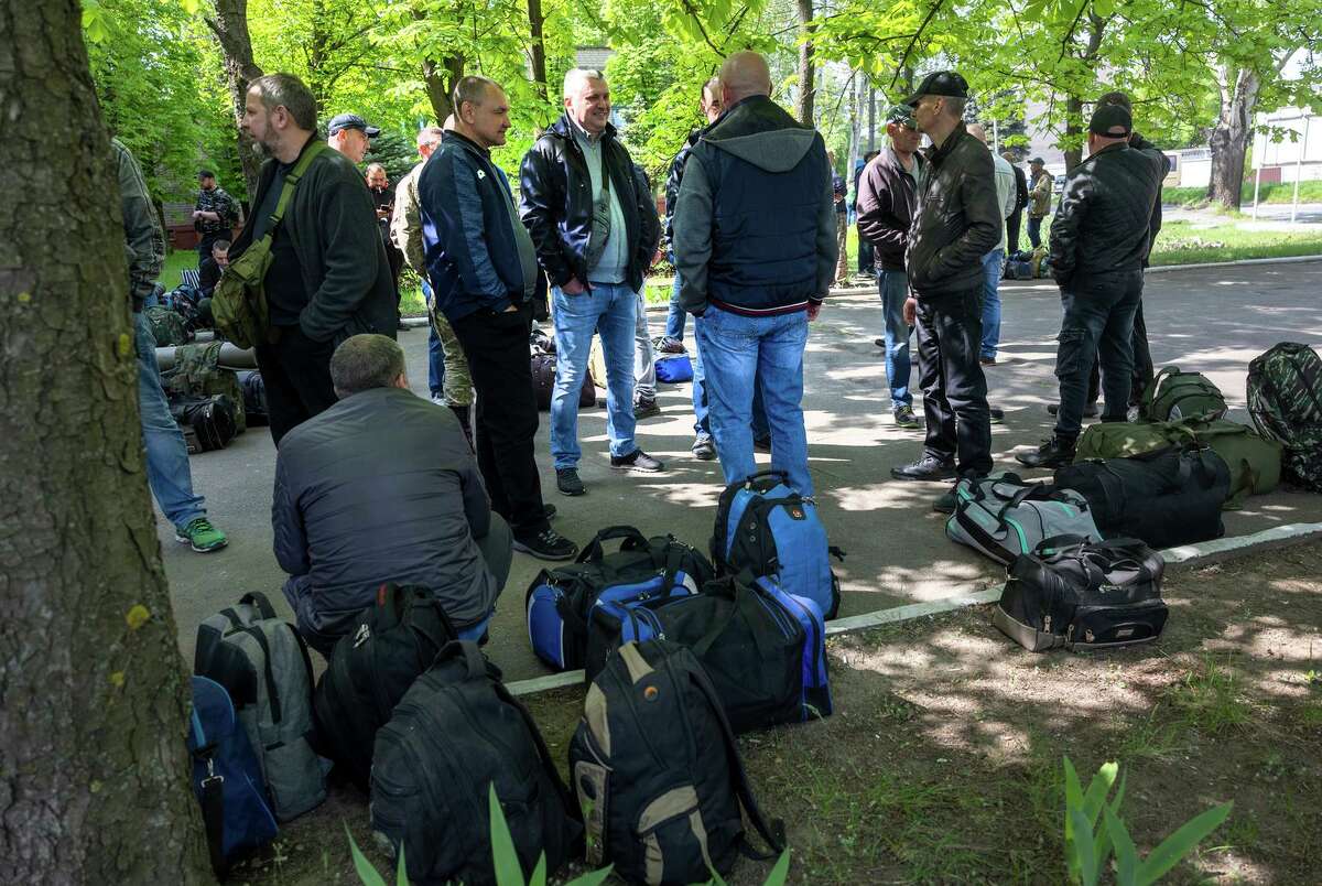 Men report to enlist in Ukrainian Territorial Defense units in Kryvyi Rih, Ukraine. Many of the people volunteering to fight Russian invaders are lacking body armor, something a Bay Area startup is helping supply.
