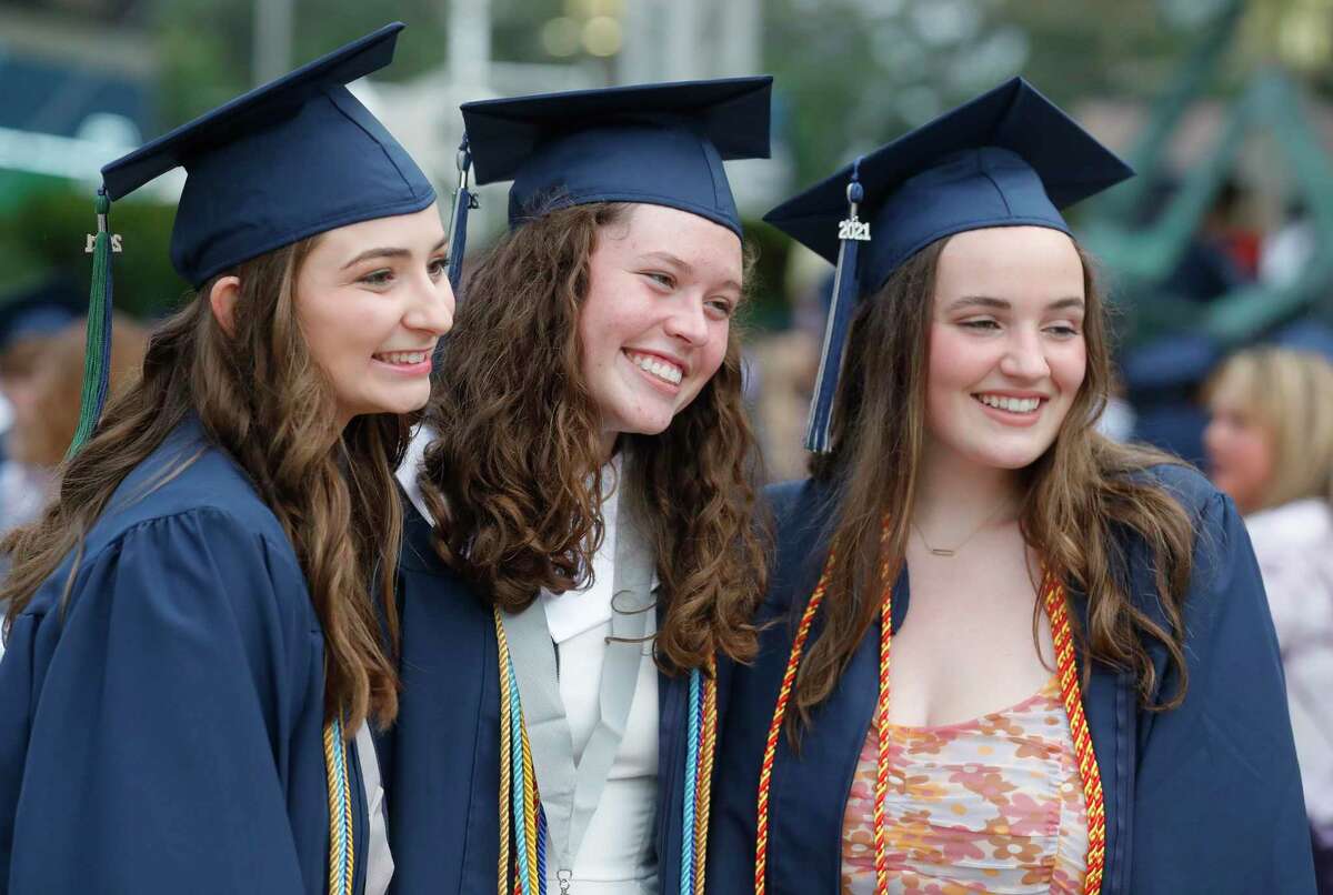 College Park students Sydney Rodgers, Riley Horne and Caroline Hammond pose for a photo before a graduation ceremony at Cynthia Woods Mitchell Pavilion, Monday, May 24, 2021, in The Woodlands.