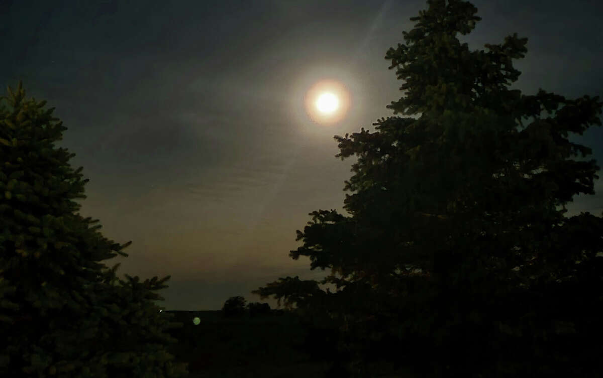 The morning full moon lights up the sky Monday over Clements in Morgan County.