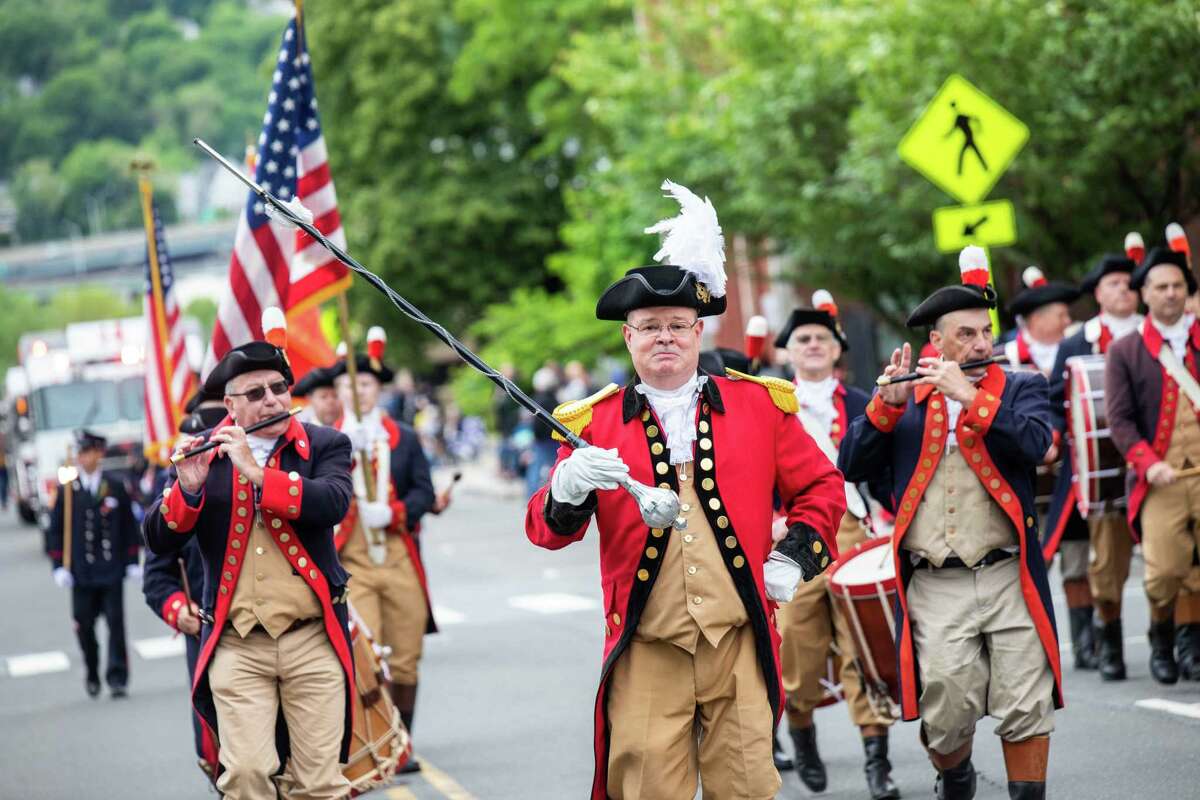 Doug Jennings of the Mattatuck Drum Band marches in the Derby-Shelton Memorial Day Parade on May 31 2021.