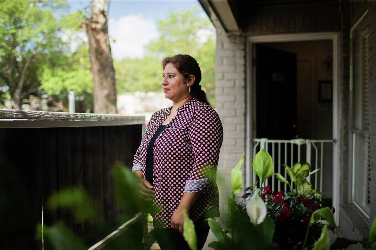 Latinos for Education 2021 fellow Monica Reyes, 40, and mother of an undocumented student, stands on the balcony of her home, Tuesday, May 17, 2022, in Houston.